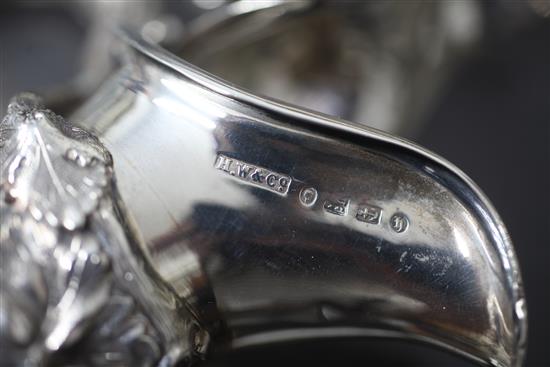 A good pair of Victorian silver mounted cut glass claret jugs by Horace Woodward & Co, 30cm.